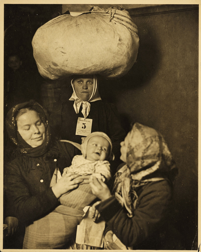 Lewis Wickes Hine, Slavic Mother & Child, Ellis Island (George Eastman House), 1905. Portrait of three women and a baby. Just arrived to Ellis Island along with hundreds of other immigrants that day. In search of a better life. USA 1905. This image, an iconic and evocative mother and child image, portrays the uncertainty of arriving in a strange land, and a mother's need to ensure the safety of her child. These people were amongst the hundreds to arrive at Ellis Island that day – and one of thousands that arrived in the early years of the new century, looking for a better life in a new country. Hine’s determination of depict their individualism however, is unwavering.