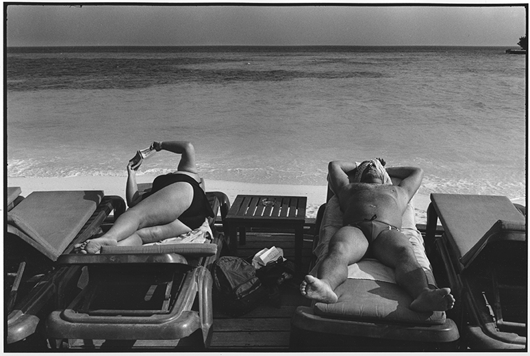 © Rune Eraker, The Maldives 2011
Finnish tourists enjoy the evening sun at the luxurious resort on Curedo Island. This is the Maldives that many dream of. 
The little island community receives 800 000 tourists annually. Financially, the Maldives are dependent on airborne tourism, 
which paradoxically enough contributes to the fact that one day they may be forced off the islands when the sea level rises.
The rising sea level threatens the existence of the Maldive Islands. It is a paradox that the country earns its livelihood from airborne tourism that contributes to climate changes.