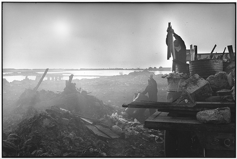 © Rune Eraker, The Maldives, 2011
Waste from foreign tourists at island resorts and from the inhabitants of Male is transported to and dumped on Thilafushi. 
Here it is burnt and scraped into the sea. As a result, the island grows by up to a square metre a day and has become 2 metres high.
This is how the authorities are trying to get ahead of the rising sea level. Average height over sea level in the Maldive Islands is one metre. 
The rising sea level threatens the existence of the Maldive Islands. It is a paradox that the country earns its livelihood from airborne tourism that contributes to climate changes.